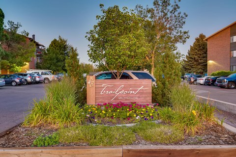 a sign in front of a parking lot